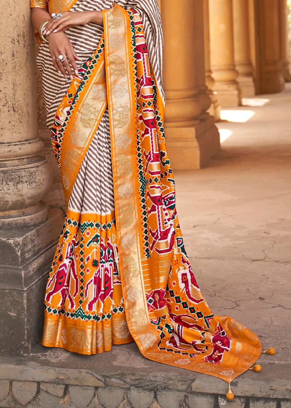 Chrome Yellow Designer Patola Silk Saree with Zari Border & Stone work